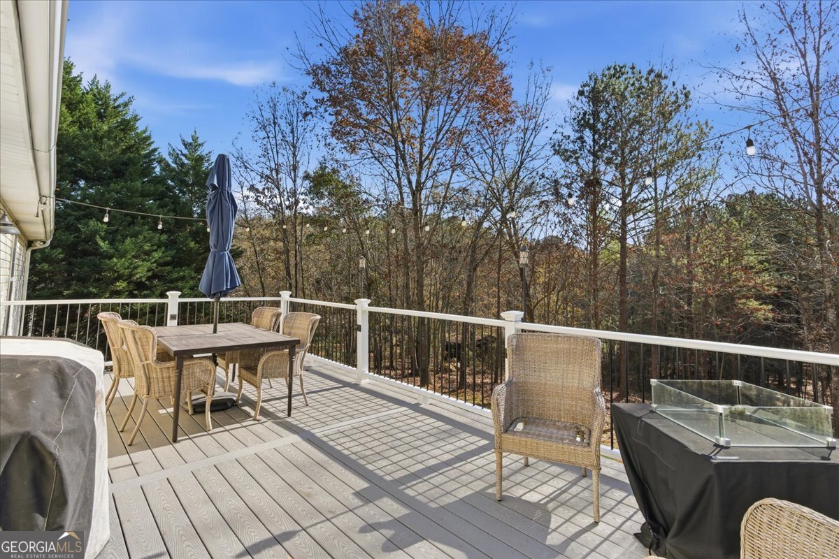 1111 Old Collard Valley Road Aragon, GA 30104 - Photo 26 of 38 a view of a roof deck with couches wooden floor and fence