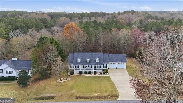 a view of a swimming pool with a yard