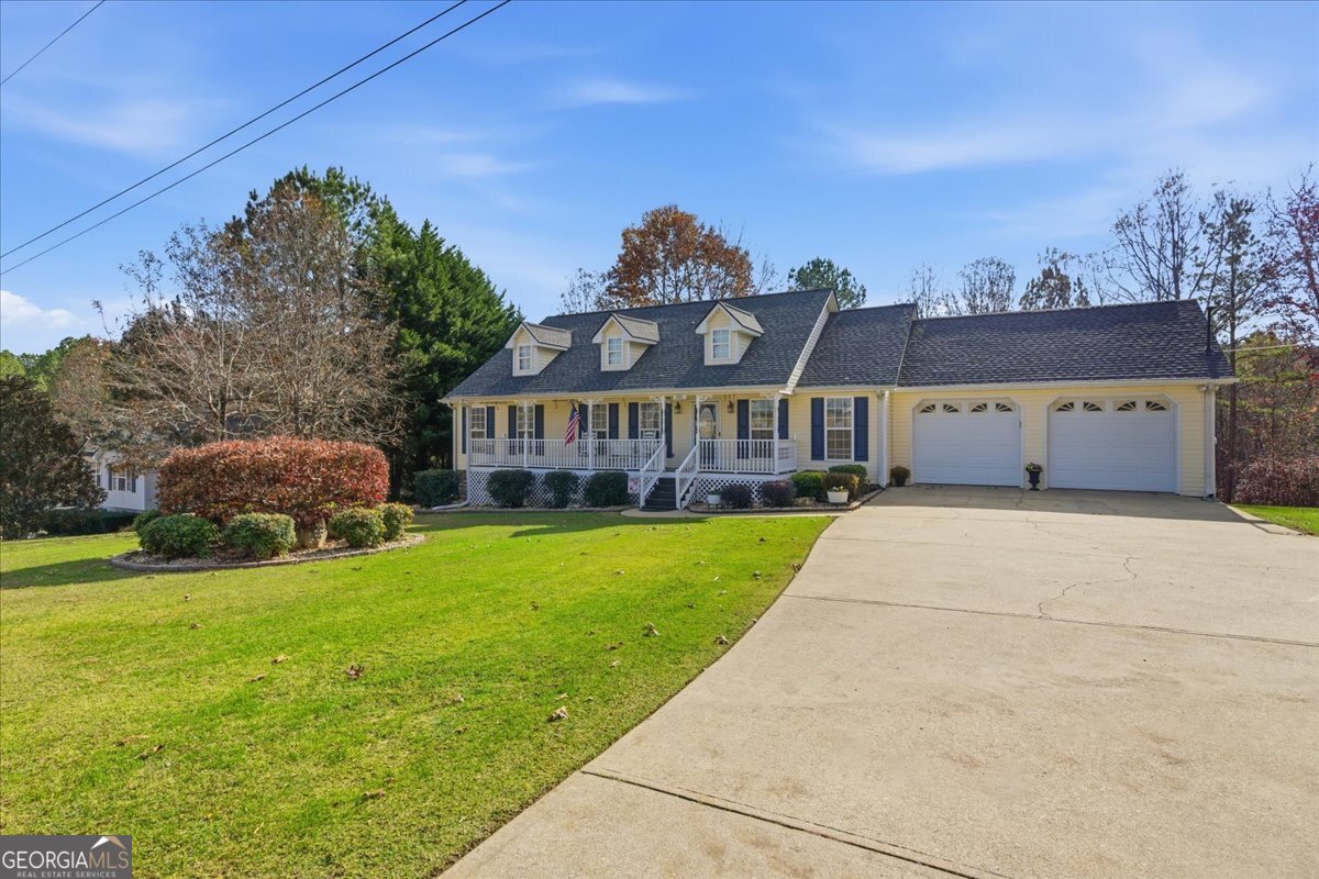 1111 Old Collard Valley Road Aragon, GA 30104 - Photo 4 of 38 a front view of a house with a garden
