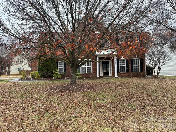 front view of a house with a trees