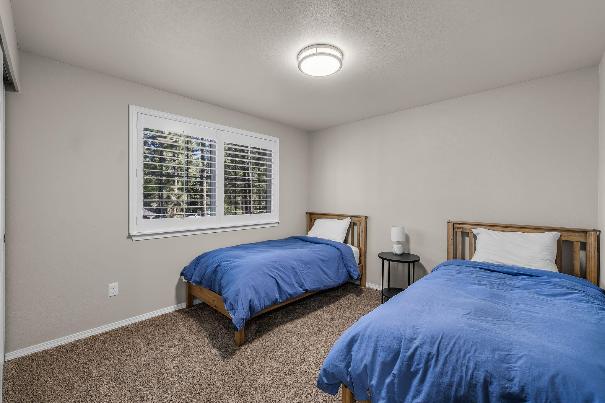 17064 Sacramento Road Bend, OR 97707 - Photo 20 of 50 a bedroom with two beds and a window