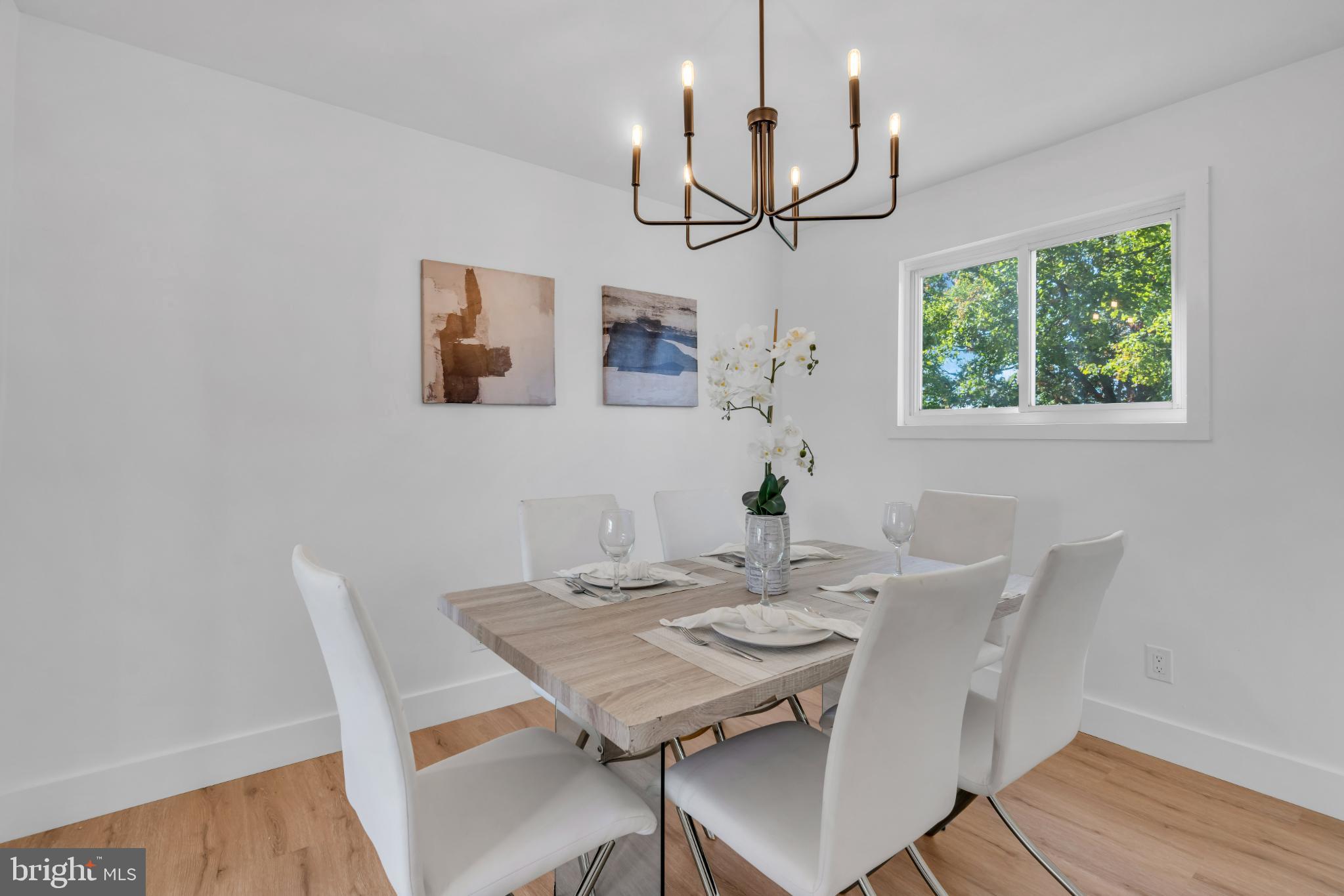 104 East Laurelton Avenue Maple Shade, NJ 08052 - Photo 11 of 37 a view of a dining room with furniture window and wooden floor