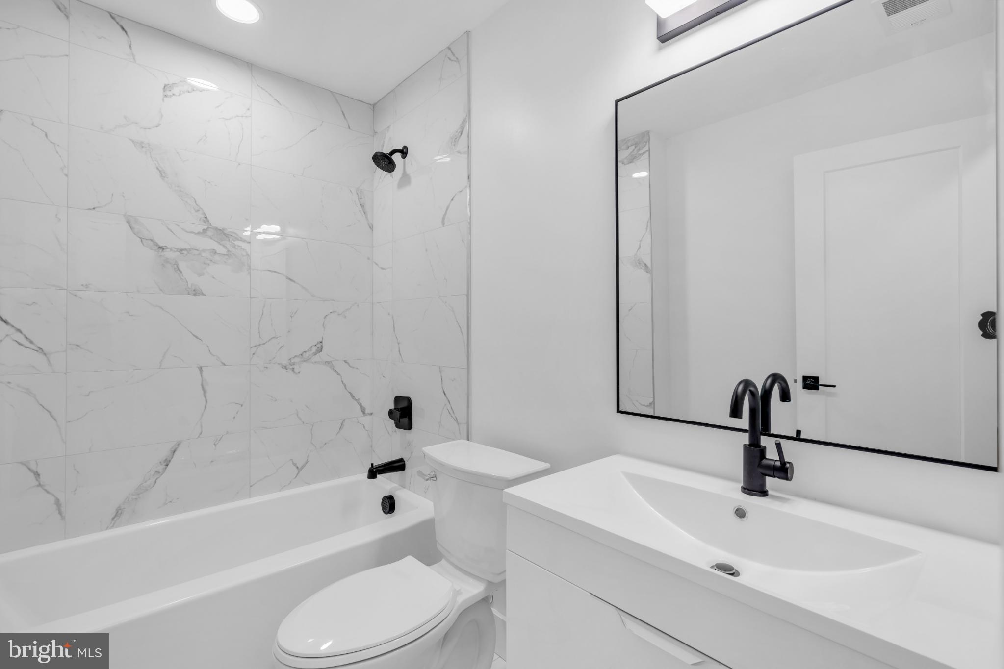 104 East Laurelton Avenue Maple Shade, NJ 08052 - Photo 17 of 37 a bathroom with a toilet sink and bathtub