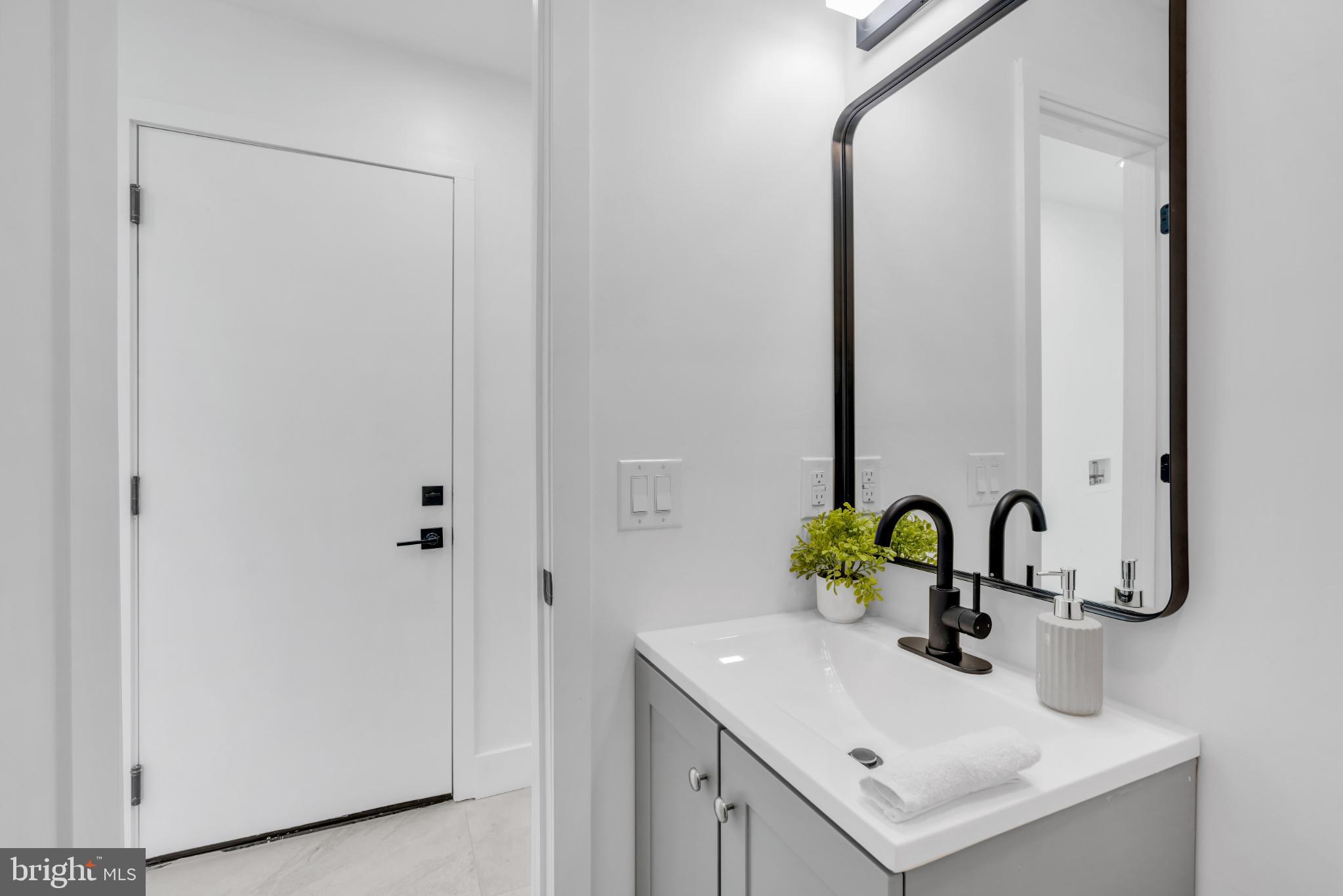 104 East Laurelton Avenue Maple Shade, NJ 08052 - Photo 23 of 37 a bathroom with a sink and a mirror