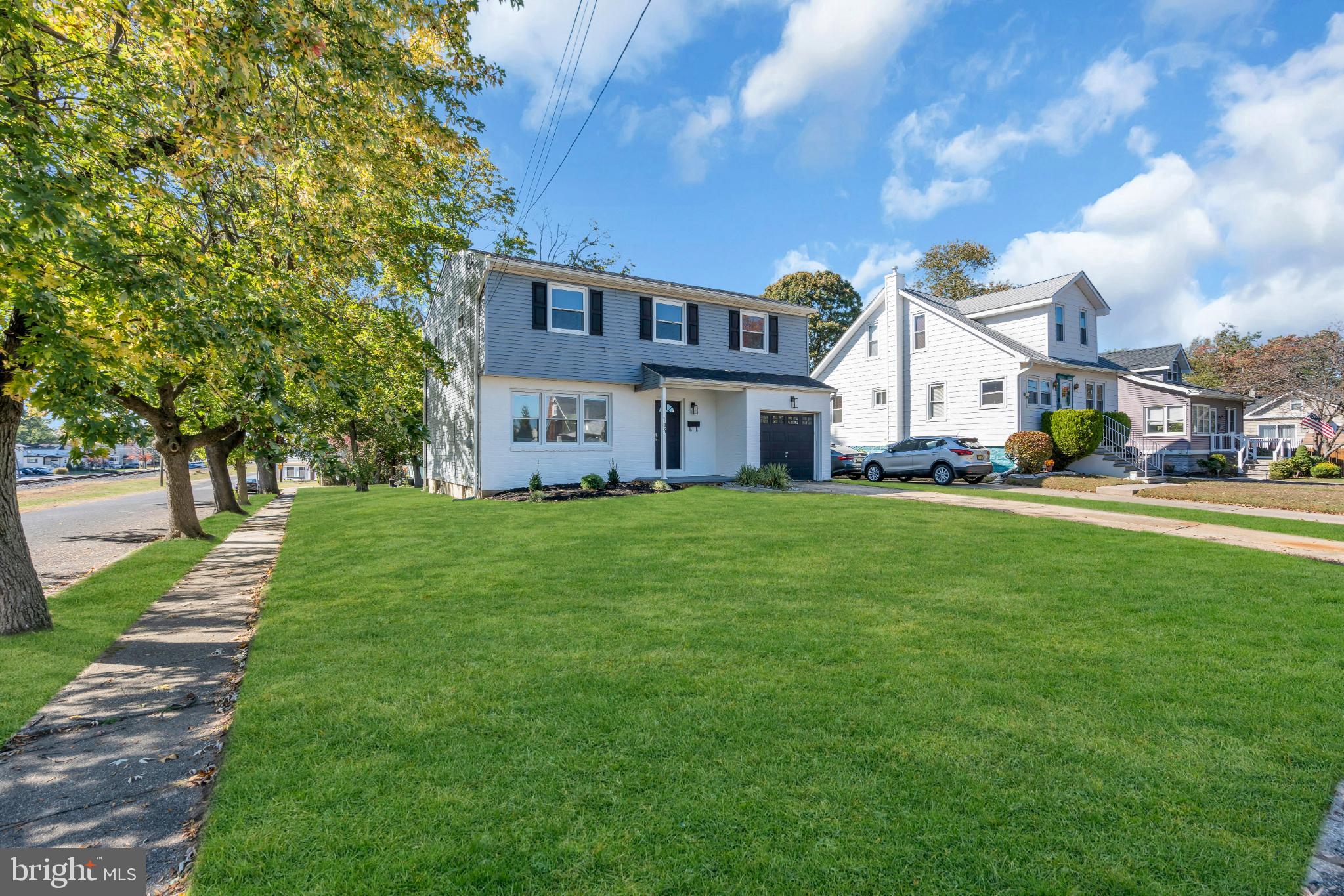 104 East Laurelton Avenue Maple Shade, NJ 08052 - Photo 3 of 37 a view of a house with a big yard plants and large trees