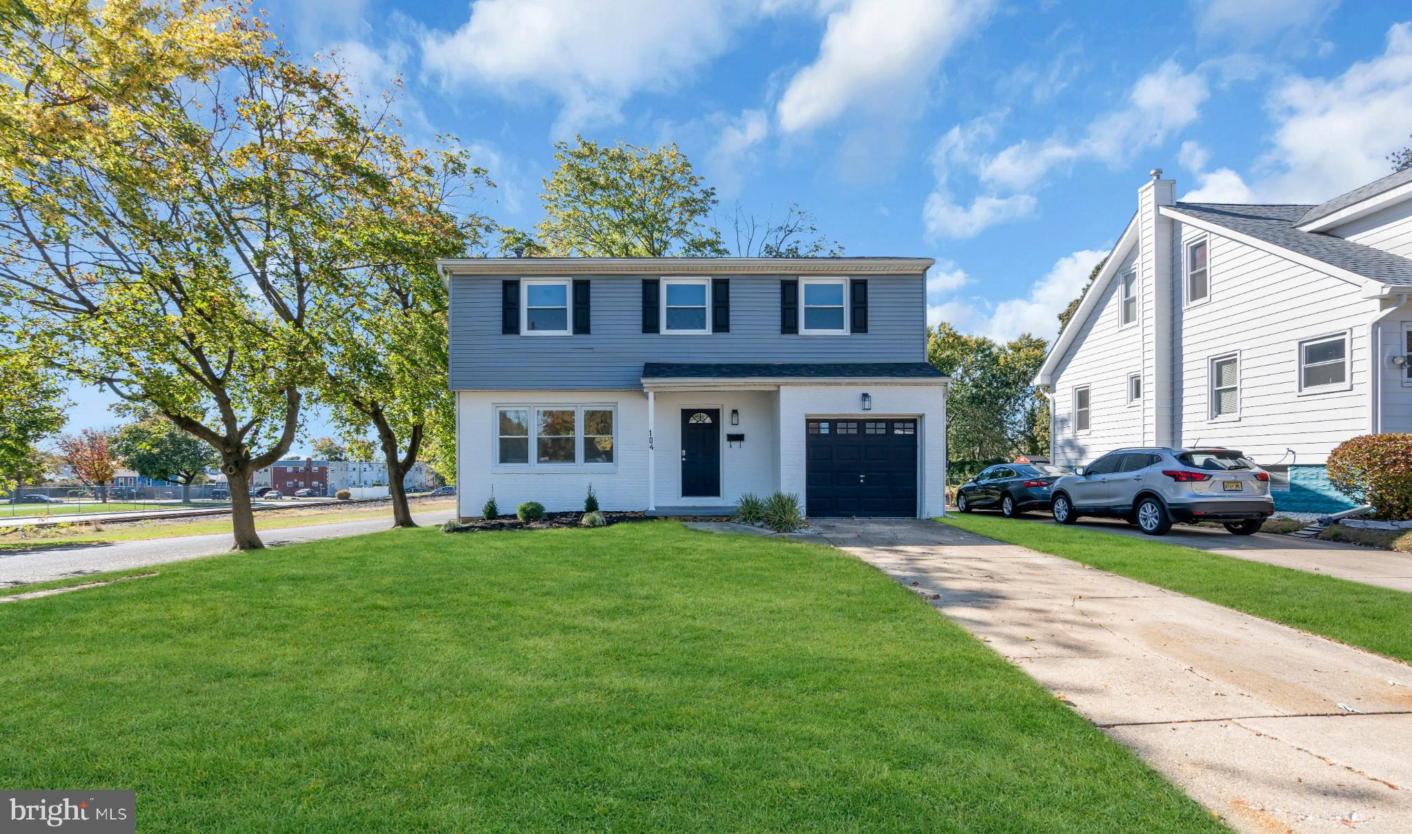 104 East Laurelton Avenue Maple Shade, NJ 08052 - Photo 33 of 37 a view of a yard in front of a brick house with a big yard