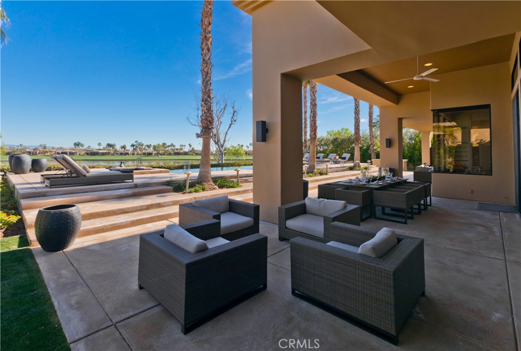 57780 Troon Way La Quinta, CA 92253 - Photo 11 of 67 a living room with couch and a floor to ceiling window
