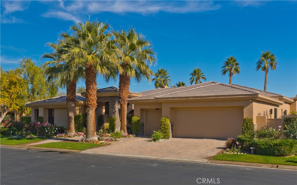 57780 Troon Way La Quinta, CA 92253 - Photo 15 of 67 front view of a house with a yard