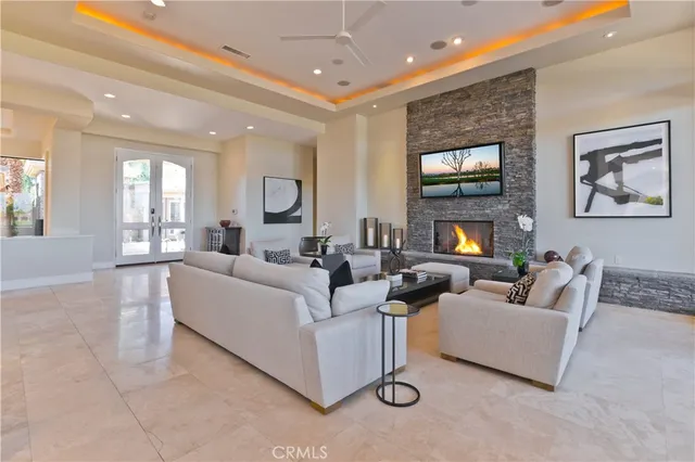 a kitchen with stainless steel appliances kitchen island granite countertop a refrigerator stove and oven