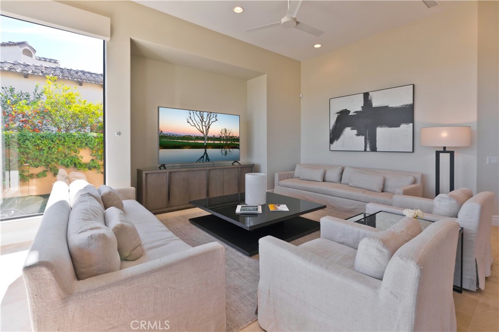 57780 Troon Way La Quinta, CA 92253 - Photo 32 of 67 a living room with furniture and a flat screen tv