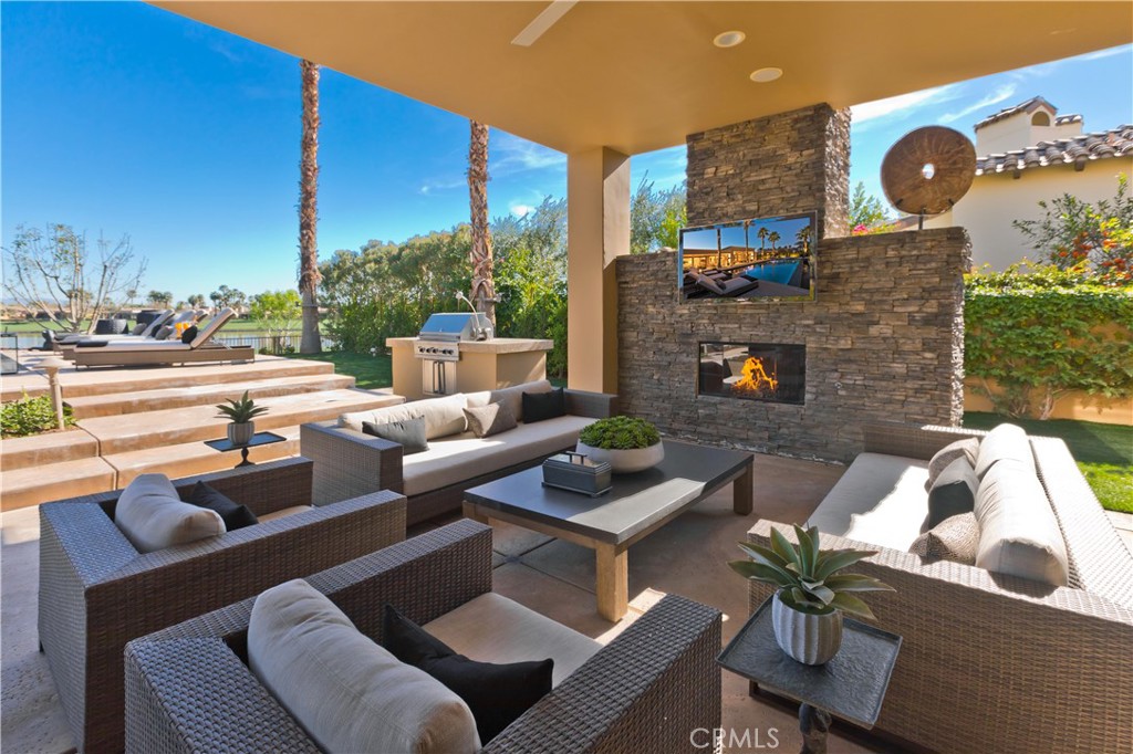 57780 Troon Way La Quinta, CA 92253 - Photo 4 of 67 a outdoor living space with furniture potted plant and a large window