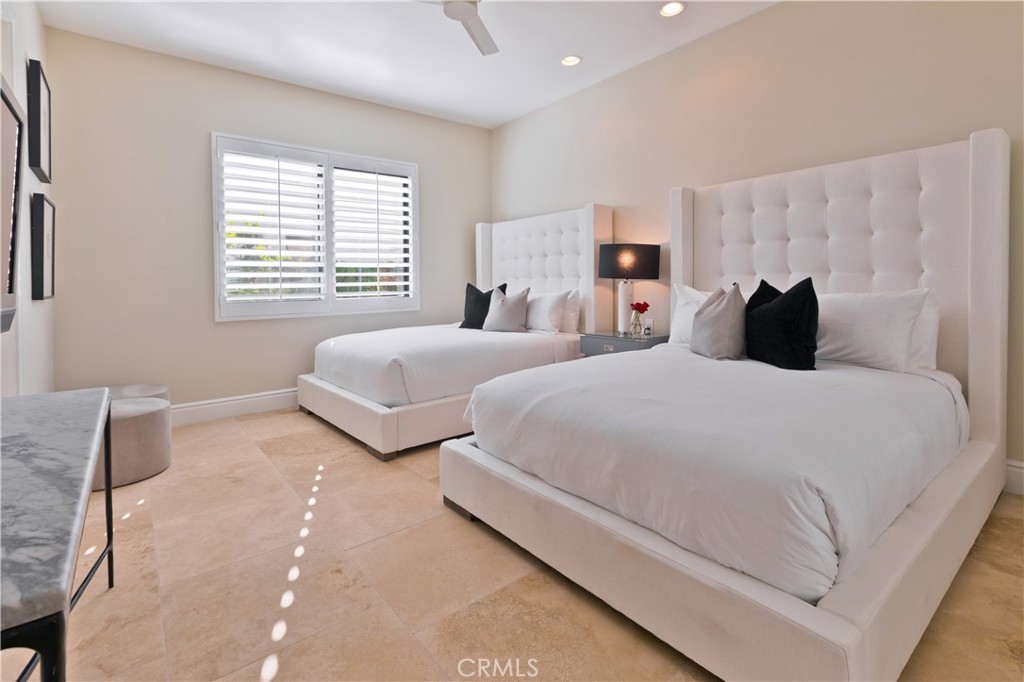 57780 Troon Way La Quinta, CA 92253 - Photo 50 of 67 a bedroom with two beds and a couch