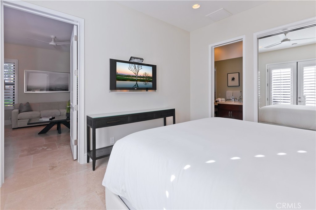 57780 Troon Way La Quinta, CA 92253 - Photo 59 of 67 a bedroom with a bed and a flat screen tv