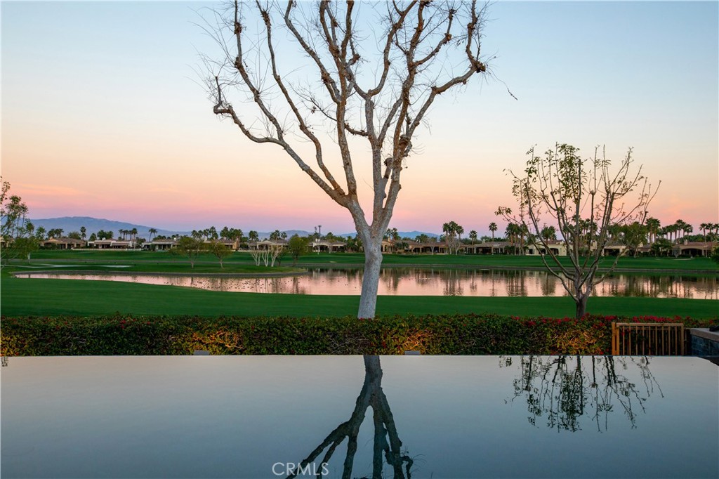 57780 Troon Way La Quinta, CA 92253 - Photo 63 of 67 a view of a lake with houses in the background