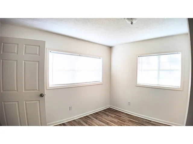 a black and white photo of a living room