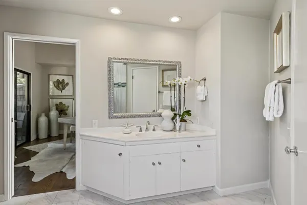 a en suite bathroom with double sink and a mirror