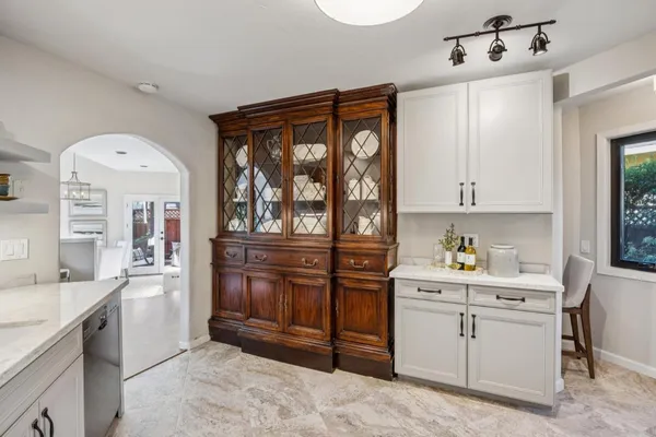 a kitchen with a refrigerator and window