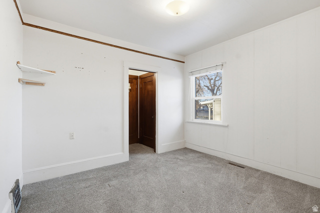 202 Main Street Smithfield, UT 84335 - Photo 17 of 32 Empty room featuring light carpet and baseboards