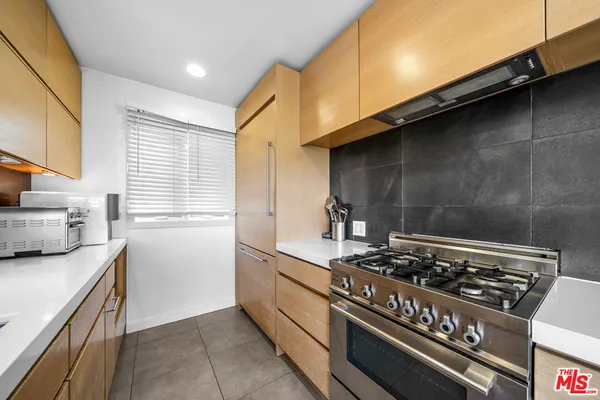 a kitchen with a stove and a sink