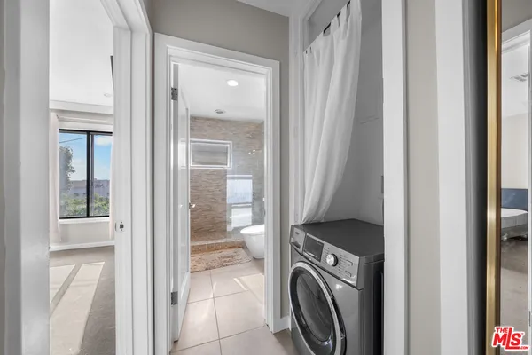 a view of a bathroom from a hallway