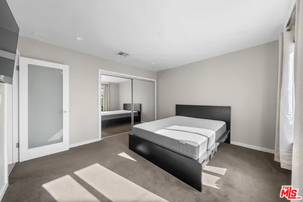 a room with a bed and a window