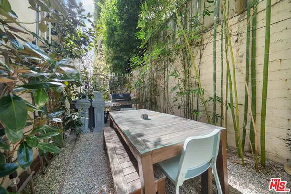 a view of a backyard with furniture