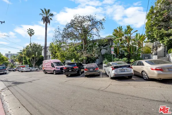 a view of street with parked cars