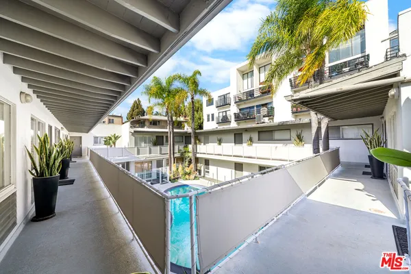 a view of a balcony with chairs