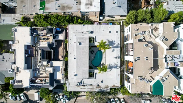 an aerial view of residential house with outdoor space and parking