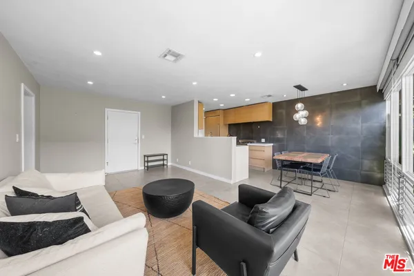 a living room with furniture and a table