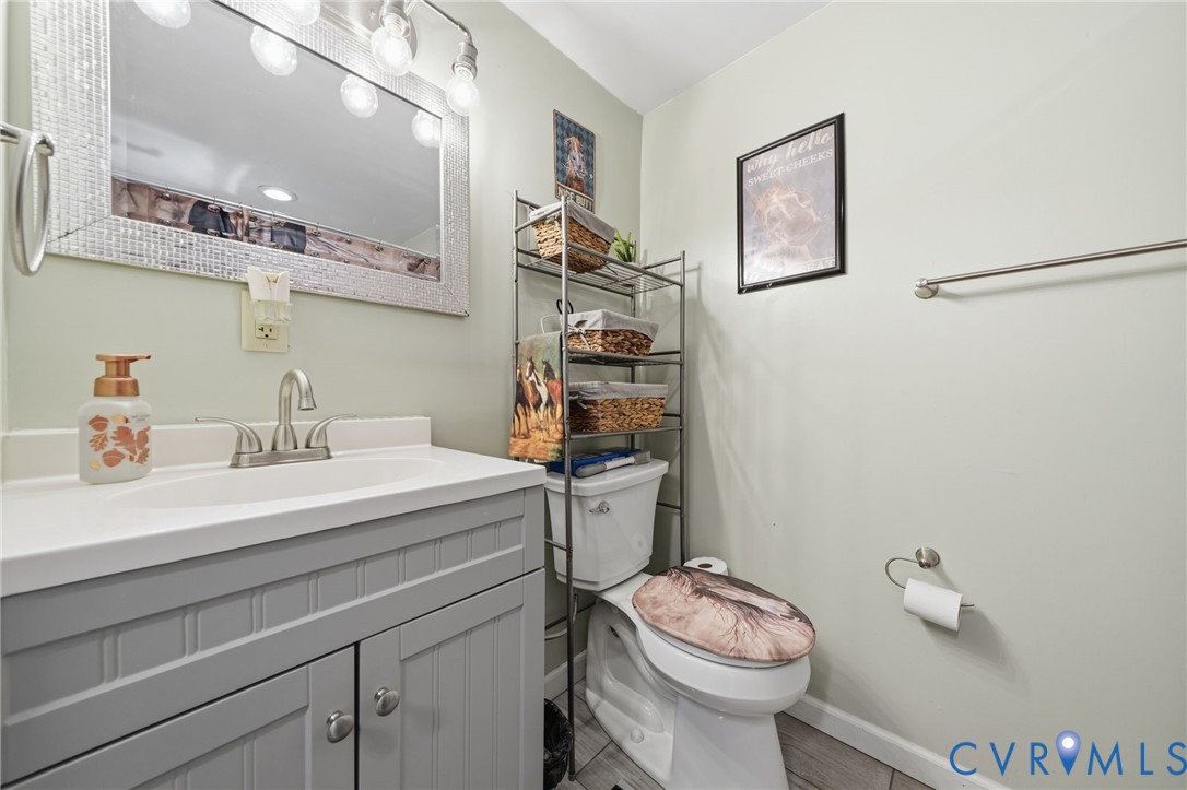 89 Old House Farm Road Bumpass, VA 23024 - Photo 26 of 67 Bathroom vanity featuring a white countertop, brus