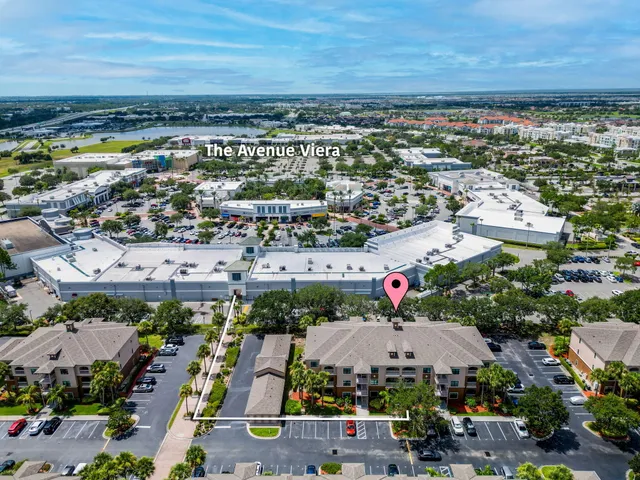 an aerial view of a house with a yard and garden