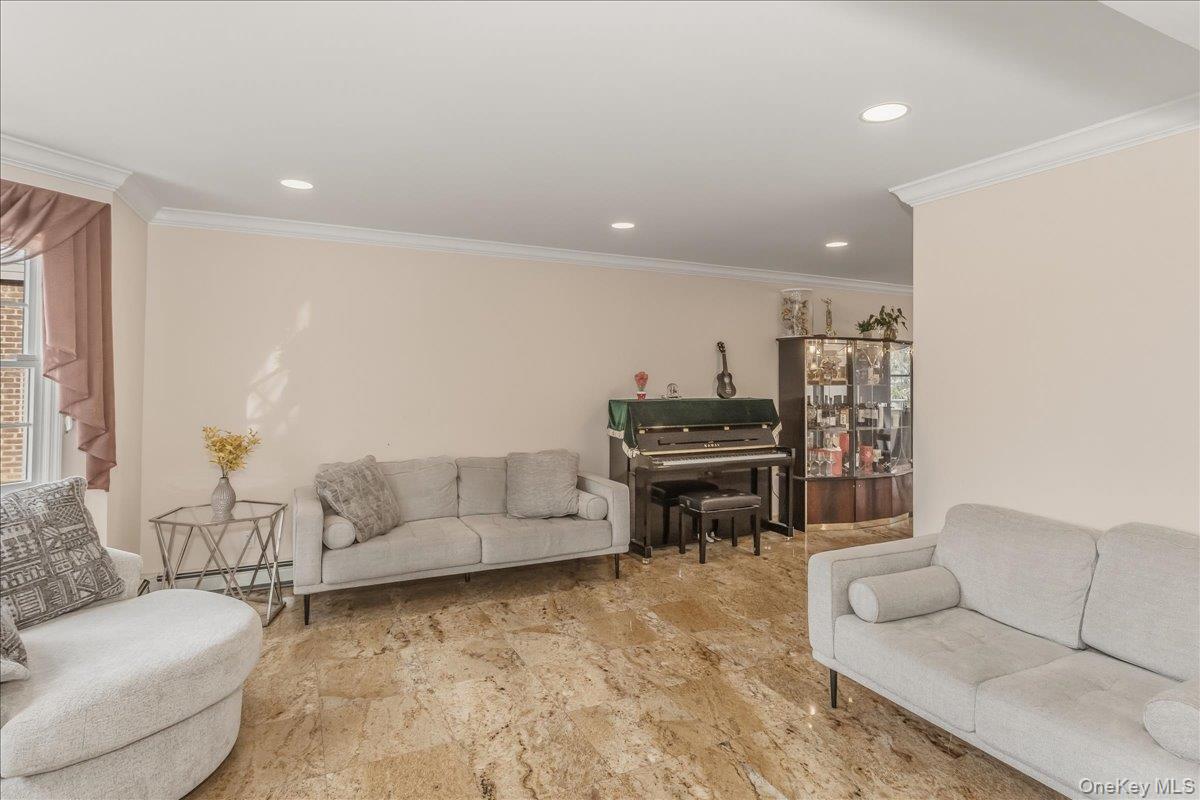 263 James Street Franklin Square, NY 11010 - Photo 2 of 23 a living room with furniture and a piano