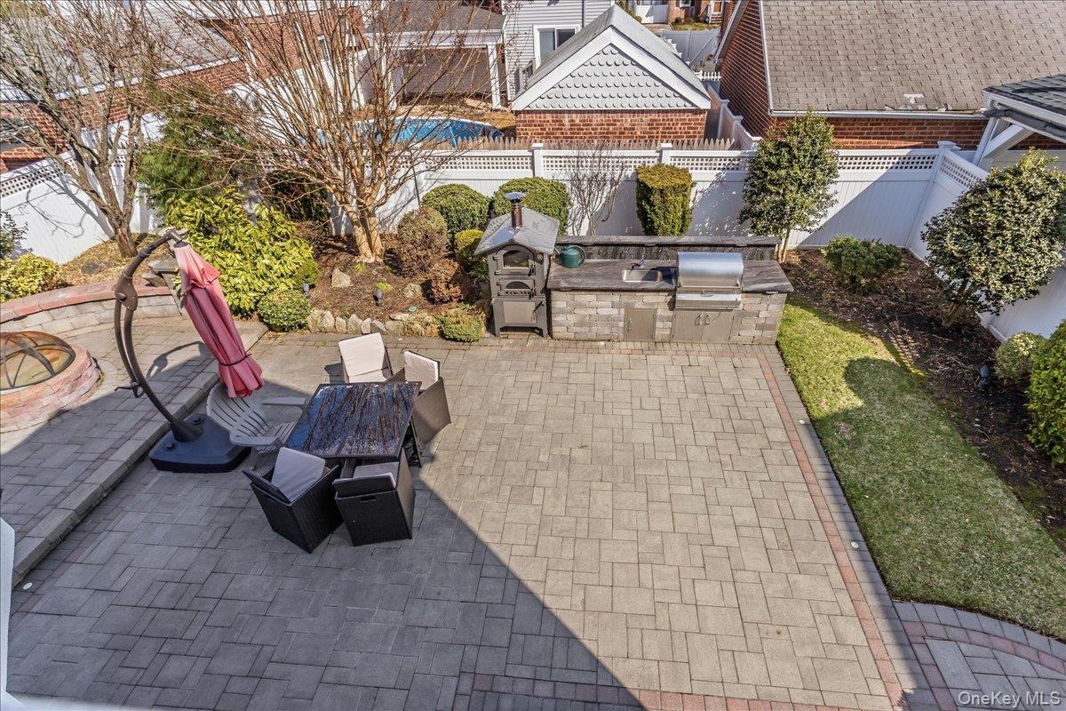 263 James Street Franklin Square, NY 11010 - Photo 21 of 23 a view of a swimming pool with sitting area