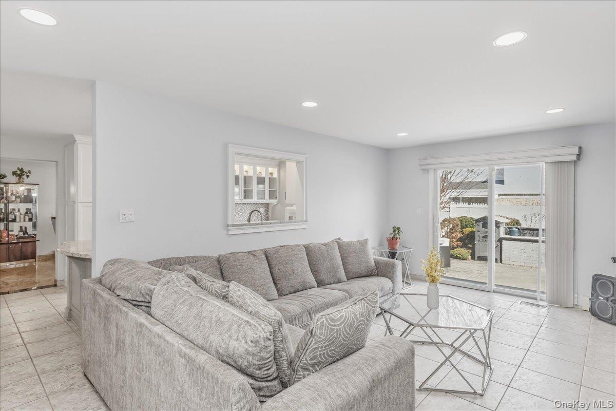263 James Street Franklin Square, NY 11010 - Photo 10 of 23 a living room with furniture and a couch