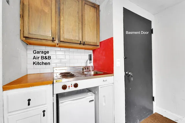 a bathroom with a sink mirror and toilet