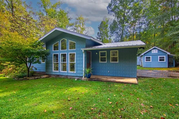 a front view of a house with a yard