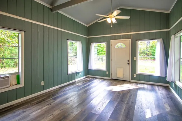 a living room with furniture and a window