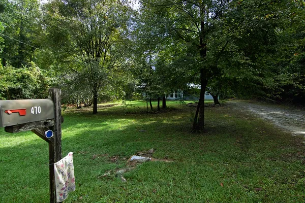 view of a house with a yard