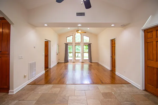 a room with a dresser and a window