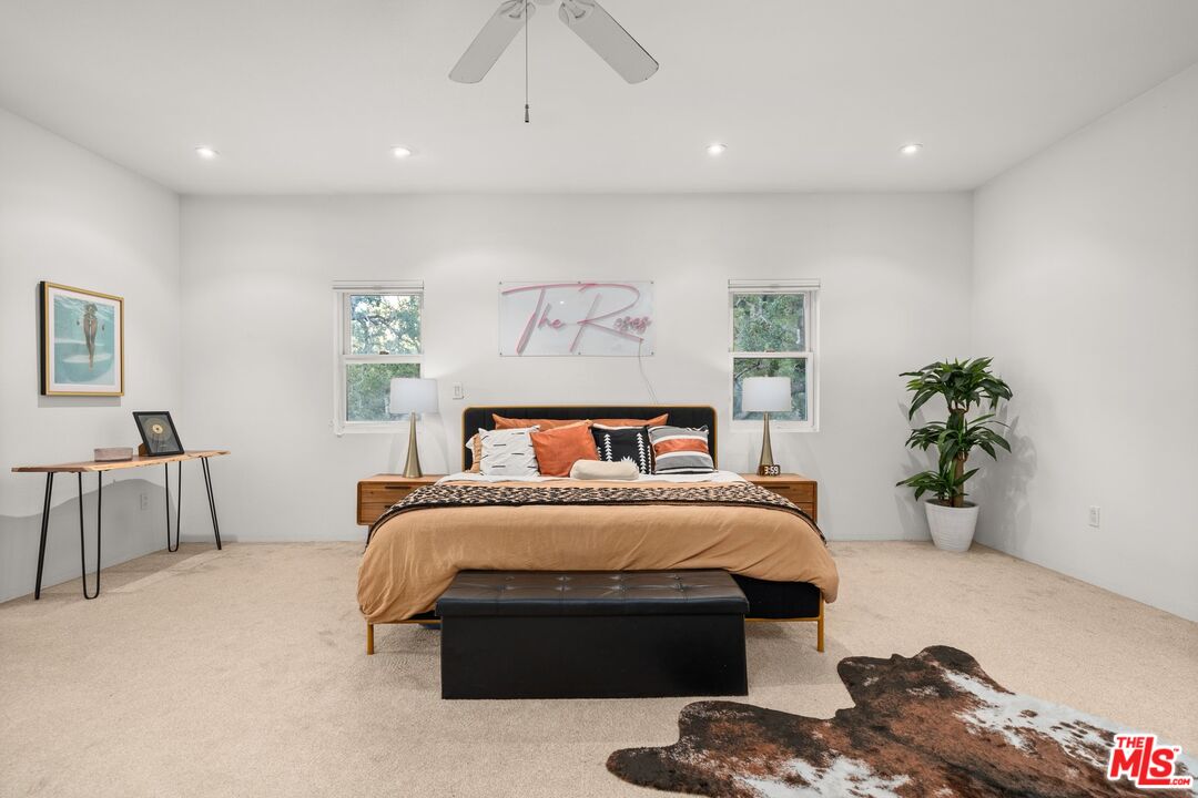 1083 Katherine Road Simi Valley, CA 93063 - Photo 28 of 72 a bedroom with a large bed and a potted plant