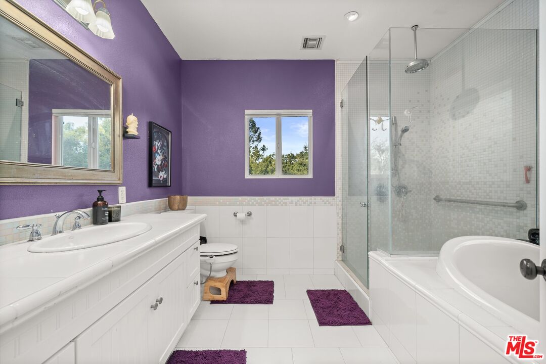 1083 Katherine Road Simi Valley, CA 93063 - Photo 34 of 72 a bathroom with a sink a tub and a mirror