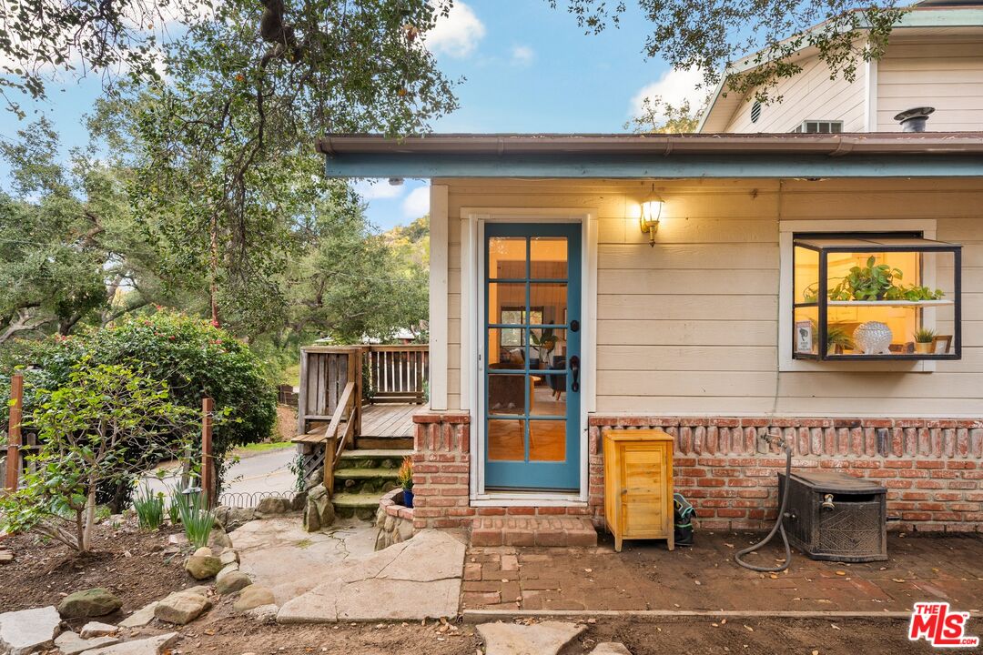 1083 Katherine Road Simi Valley, CA 93063 - Photo 47 of 72 a view of a patio with table and chairs with wooden fence and plants