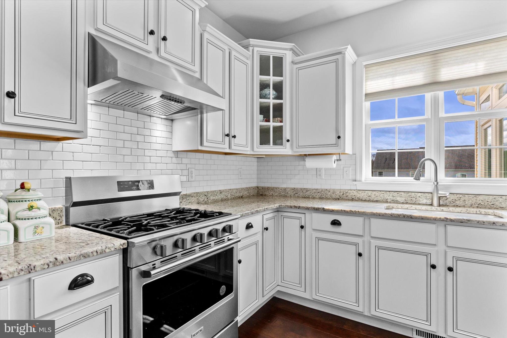 3 Rycroft Road Mechanicsburg, PA 17050 - Photo 13 of 55 a kitchen with stainless steel appliances granite countertop white cabinets and a stove a oven with white countertops