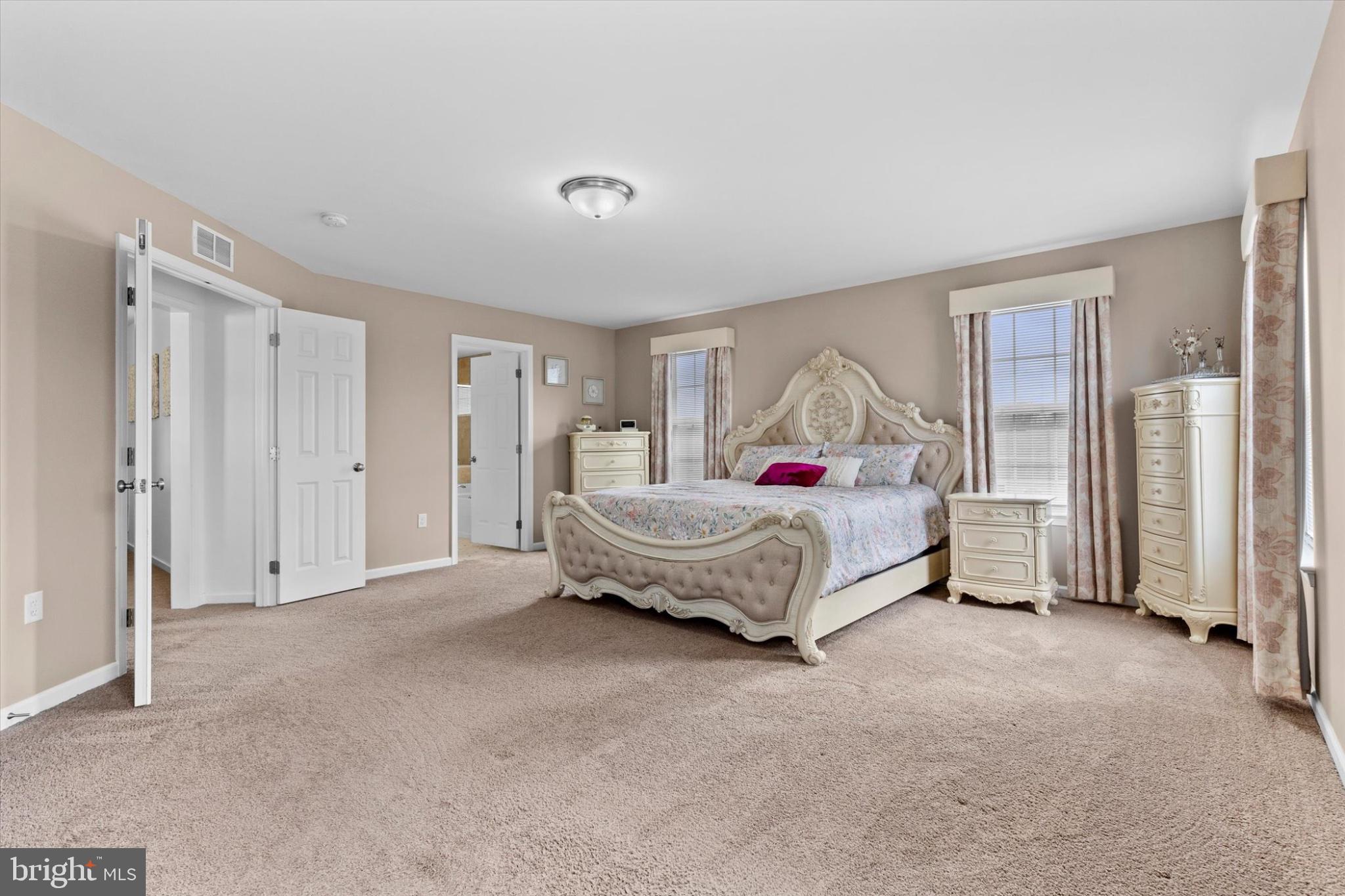 3 Rycroft Road Mechanicsburg, PA 17050 - Photo 22 of 55 a spacious bedroom with a bed and a window