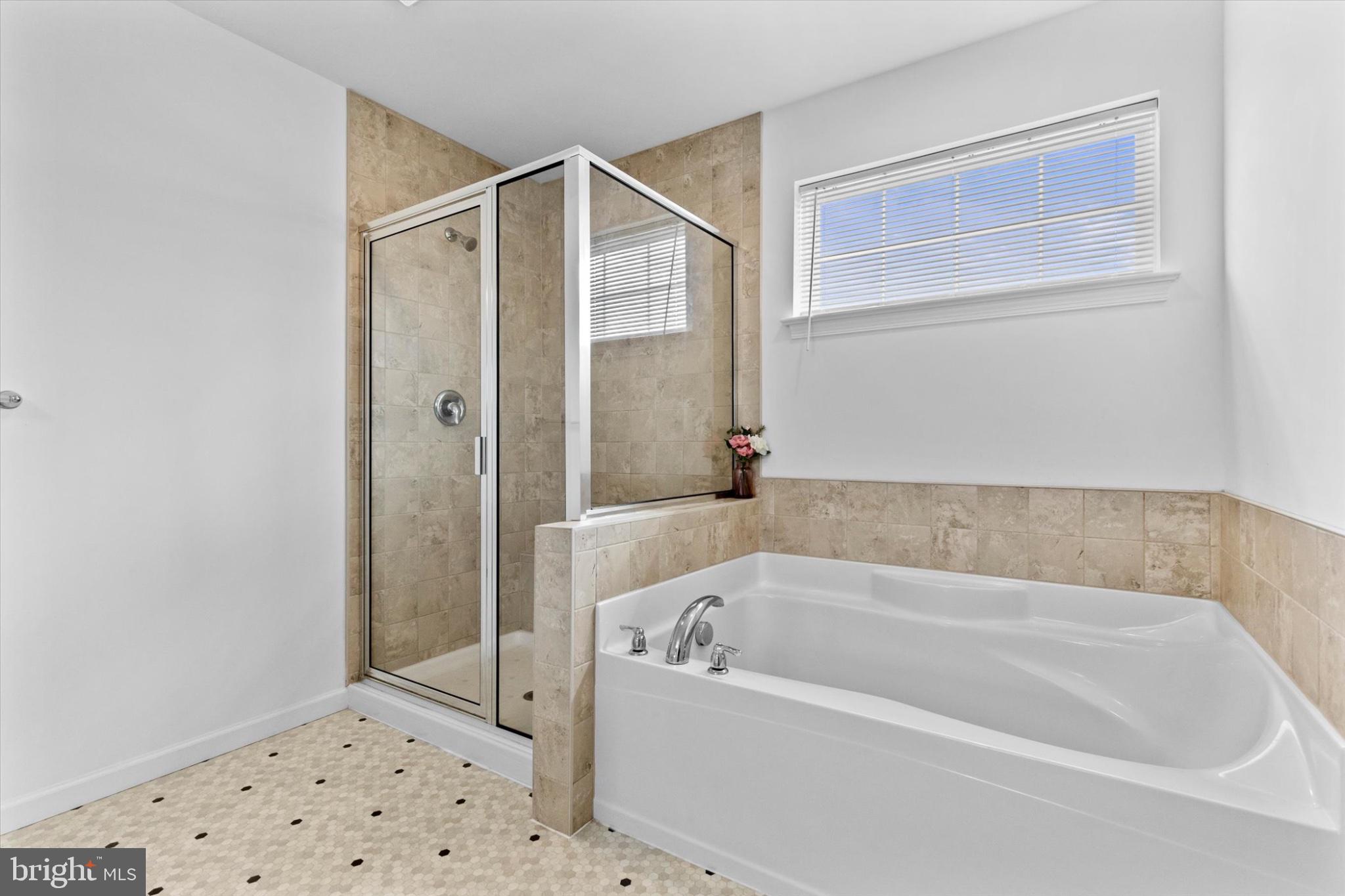 3 Rycroft Road Mechanicsburg, PA 17050 - Photo 25 of 55 a bathroom with a bathtub and a shower
