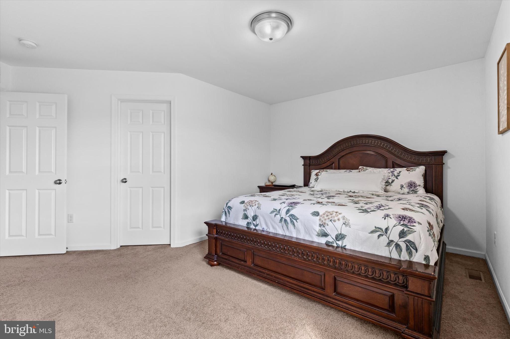 3 Rycroft Road Mechanicsburg, PA 17050 - Photo 33 of 55 a bedroom with a bed and a night stand