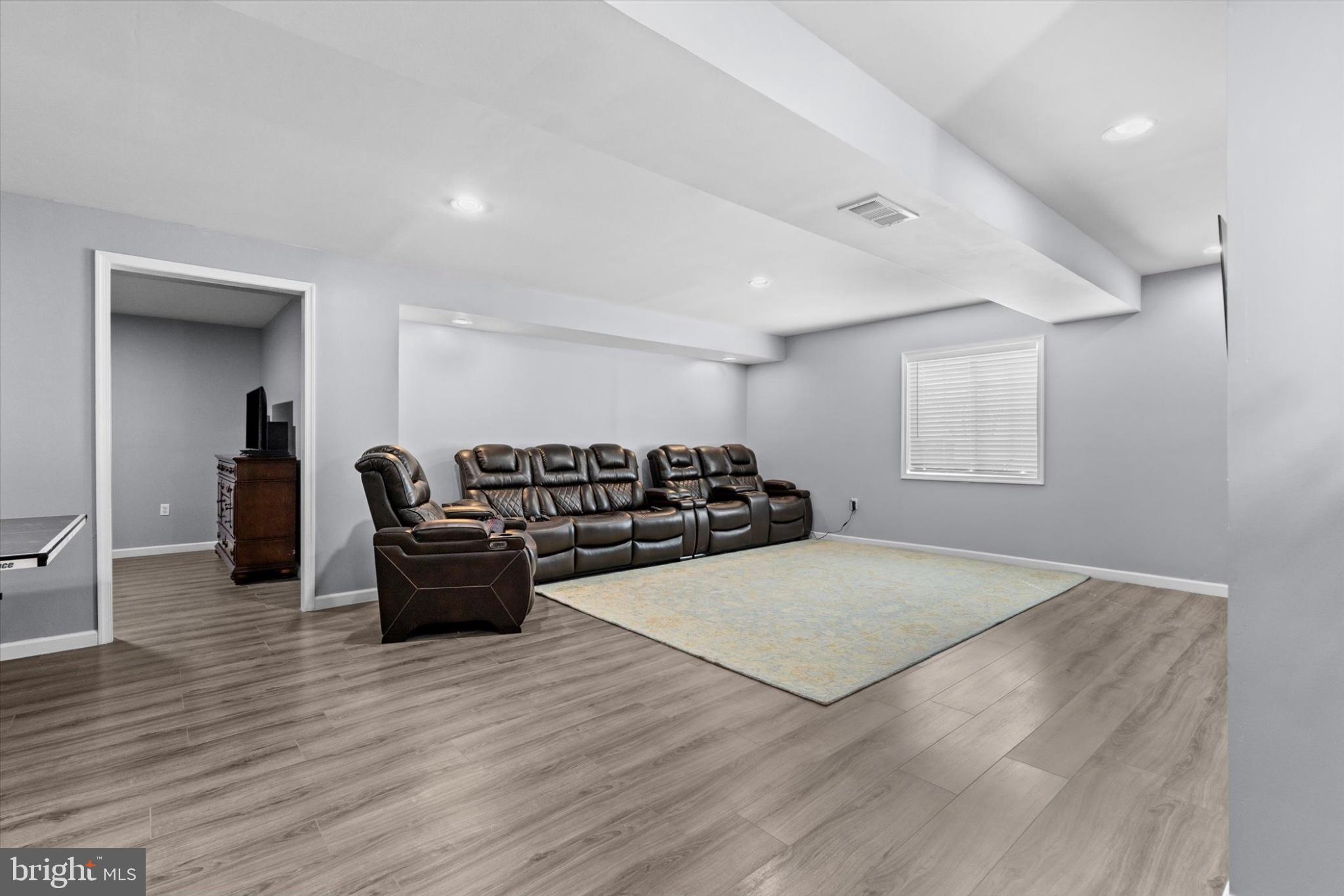 3 Rycroft Road Mechanicsburg, PA 17050 - Photo 37 of 55 a living room with furniture and wooden floor