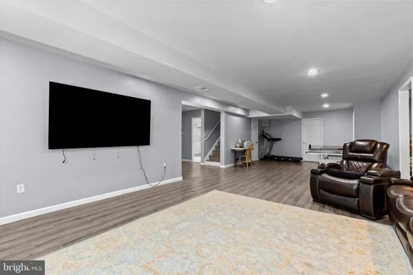 a bedroom with a bed and a television