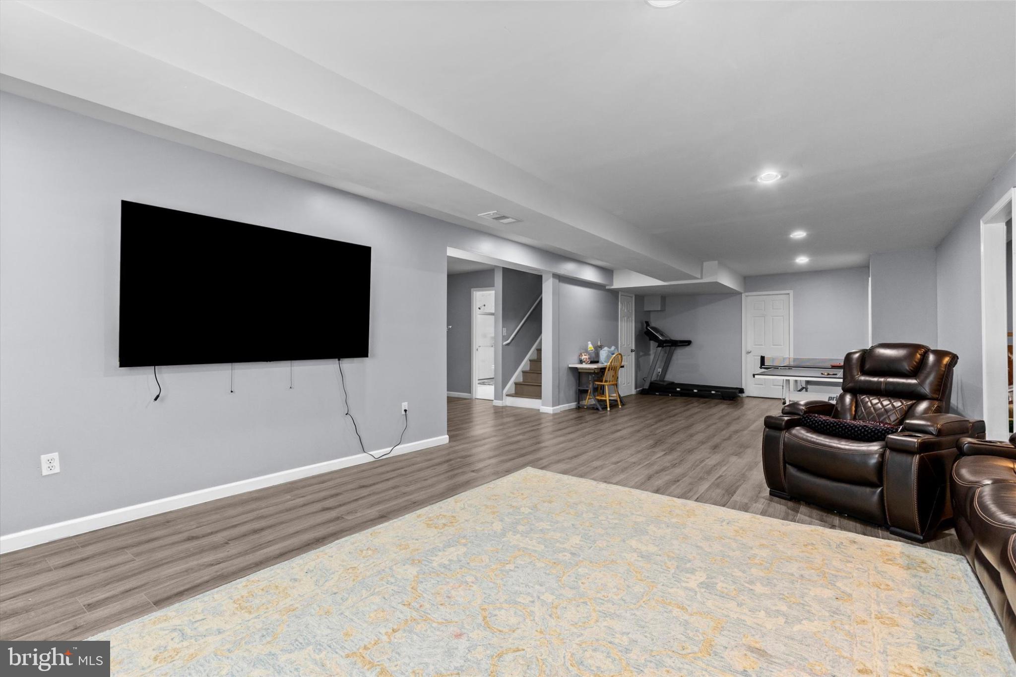 3 Rycroft Road Mechanicsburg, PA 17050 - Photo 39 of 55 a living room with furniture and a flat screen tv